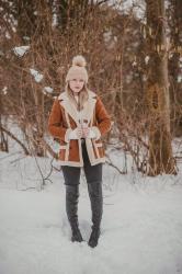 A Brown Del Boy Coat In The Snow