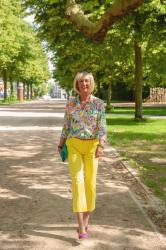 Lemon yellow trousers and multi-coloured shirt