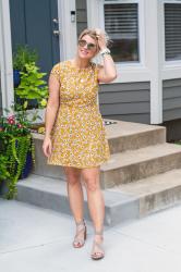 Mustard Floral Dress + Gray Sandals with Gold Earrings.