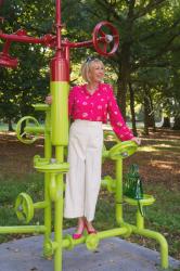 Wearing a bright pink floral blouse to an antique market