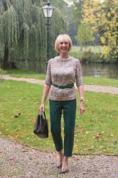 Green trousers with a leopard top