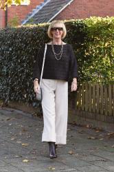 Cream trousers with a brown jumper