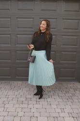 Twirling in a Pleated Croc Midi Skirt