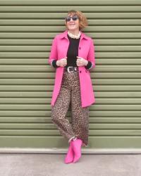 Bright pink jacket and leopard trousers