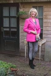 Bright pink jacket with houndstooth leggings and retirement