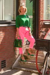 Pink trousers with a green jumper