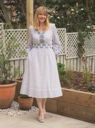 Charming In A White And Blue Embroidered Dress