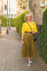 Yellow and black pleated skirt