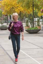 Sequinned jumper in purple and black