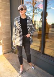 a houndstooth blazer and black denim jeans