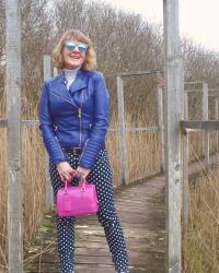 Jeans and biker jacket with Furla handbag