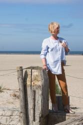 Wearing a blue shirt one morning at the beach