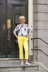 Blue and white top with yellow trousers in Amsterdam