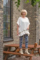 Cream top with artsy vibe and patterned trousers