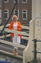 Orange jacket with white trousers