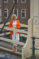 Orange jacket with white trousers