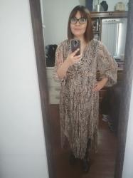 Outfit propio: Vestido midi de animal print.