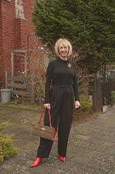 Wide black trousers with a black fitted top