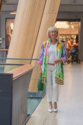 A colourful dress worn as a jacket