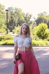 A Pink Maxi Skirt With A White Bardot Top