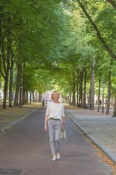 Grey trousers with a cream top in The Hague