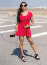 Enjoying the summer in a red mini dress (heels optional)