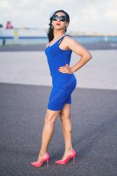 A simple blue dress with some simple pink heels