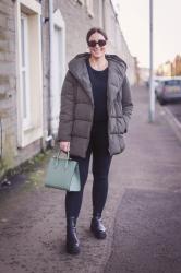 A puffer jacket and a spring handbag