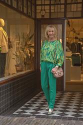 Green suit with green and yellow blouse