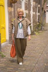 Olive coloured trousers with a pale blue blouse