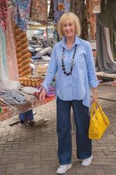 Light blue pinstriped shirt on wide leg jeans