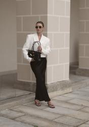 Black satin skirt, white oversize blazer and jw pei bag