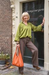 Brown jeans with a green top