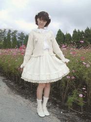 Iori wears an unknown Emily Temple Cute heart pocket cardigan in off-white.