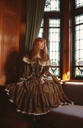 Yuki wears Meta&rsquo;s unknown bouquet print blouse and cape in brown. 